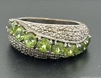 Front view of sterling silver peridot band ring