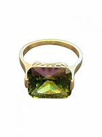 Front view of sterling silver ring with green gemstone