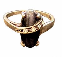 front view of sterling silver ring showing stone and floral bezel