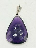 front view of faceted amethyst teardrop pendant showing colour and cut