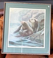 Front view showing full framed print of otters
