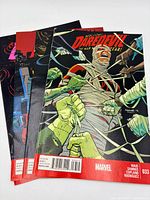 Stack of Daredevil comic books showing three visible covers