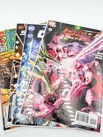 Stack of four bagged DC comic books