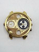 Front view of Diesel gold-tone multi-dial watch case
