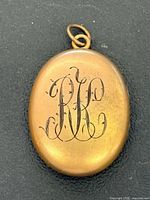 Front view showing monogram and bail