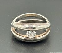 Top view of sterling silver ring with tension-set stone