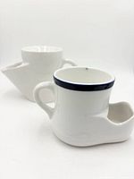 Two ceramic shaving scuttle mugs front view
