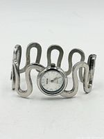 Front view of silver-tone wavy cuff watch
