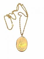 Front view of gold-filled oval locket on rope chain showing engraved floral design