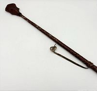 Full view of leather riding crop