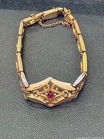 Full view of bracelet laid flat showing design and clasp
