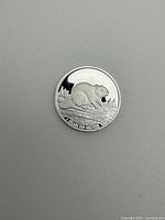 Obverse showing beaver design and .999 silver marking