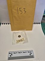 Envelope, protective sleeve and coin overview