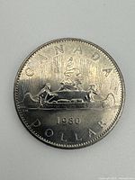 Reverse showing Voyageur canoe design and year 1980