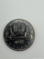 Reverse showing Voyageur canoe design and 1981 date