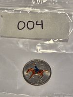 Coin in plastic bag marked 004