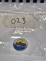 Bagged coin with lot number tag visible
