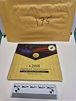 Front of U.S. Mint presentation folder with title and coin program branding