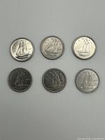 Six Canadian dimes, reverse side displayed