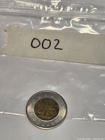 Coin inside bag marked 002