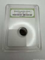 Front view of encapsulated coin showing entire holder