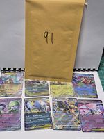 All eight sleeved Pokémon EX cards and envelope marked 91