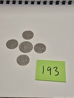 All five coins grouped