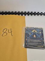 Bundle of sleeved blue Magic cards on envelope