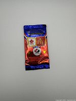 Front of sealed foil packet with graphics