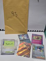 Bulk stack with sticky note and four featured cards displayed