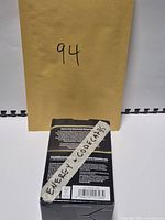 Closed retail Pokémon box labelled Energy + Codecards with envelope behind