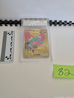 Front view of graded Roaring Moon ex card with Gem Mint 9.5 label