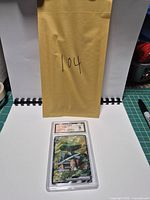 Front view of BCTC-encapsulated Torterra ex card with yellow envelope in background