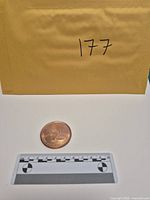 Scale reference view of round next to ruler