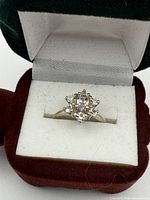 Ring in presentation box showing overall design and stones