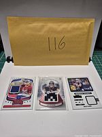 Overview of all three sleeved memorabilia cards