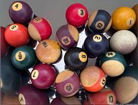 Overview of all miniature billiard balls on reflective surface
