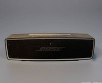 Front view showing grille and Bose logo