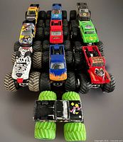 Front view of all ten Hot Wheels Monster Jam die-cast trucks