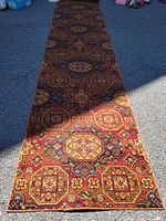 Full length view of runner rug showing geometric pattern and colors