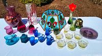 All glass items displayed on table under daylight