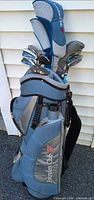Full view of Founders Club bag with clubs and headcovers