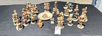 Group shot showing entire assortment of figurines and plate
