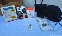 All four devices with boxes, manuals and bag overview