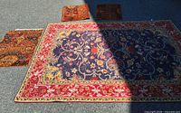Full view of large rug and three mats