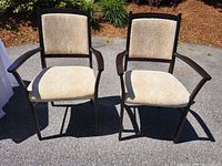 Front view of both armchairs showing upholstery and frame