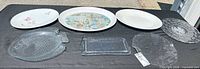 All seven platters arranged on table, showing fronts and relative sizes