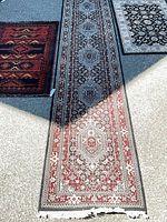 Overhead view showing full length of runner and portions of both accent rugs