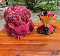 Both hats side by side on table showing overall appearance and colors