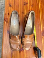 Top view of both shoes showing brand insole and leather uppers